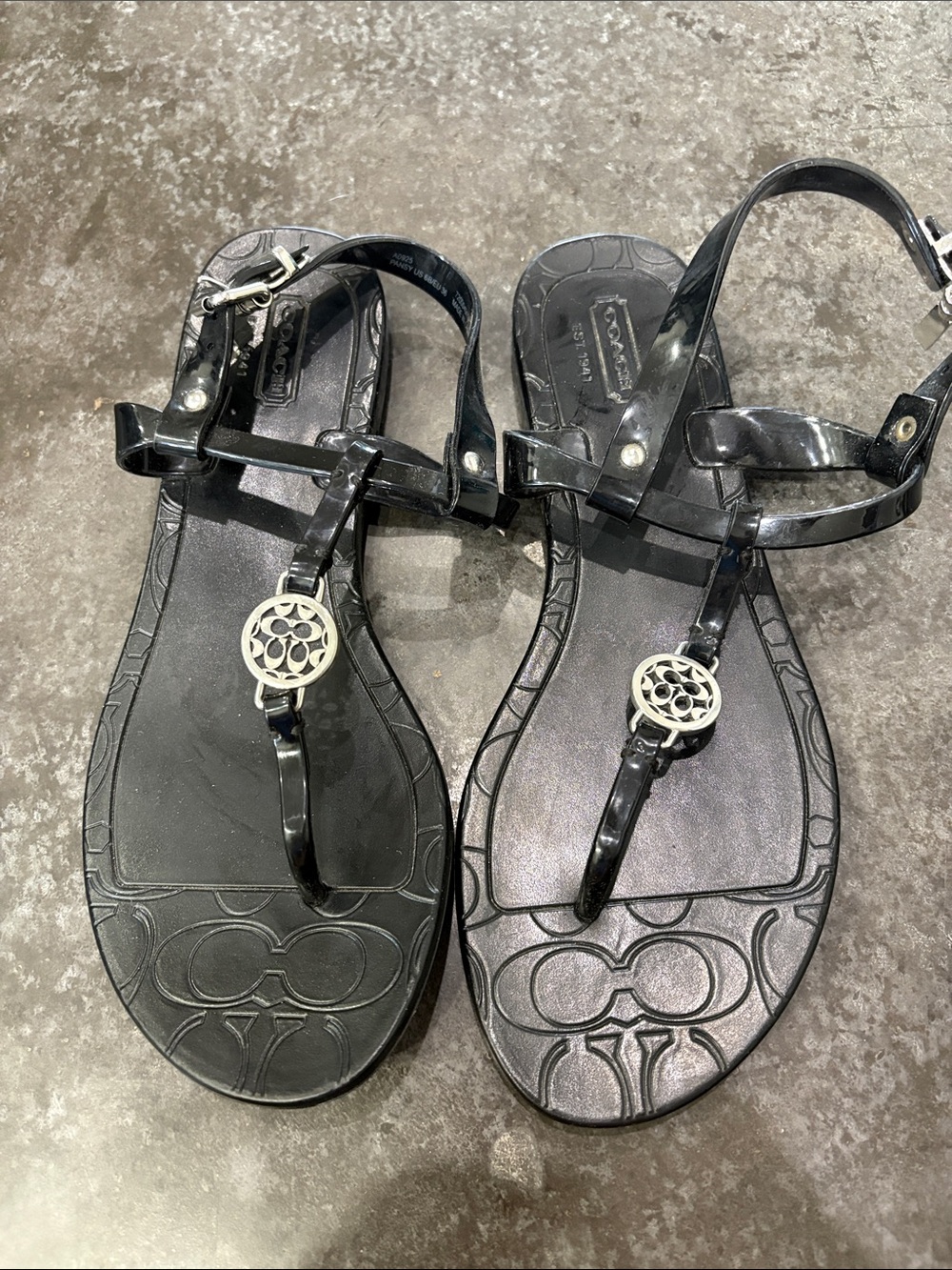 Coach Black Jelly T-Strap Sandals with Silver Logo Medallion
